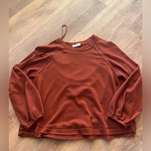 Brand New In Burnt Orange Top. Size medium.